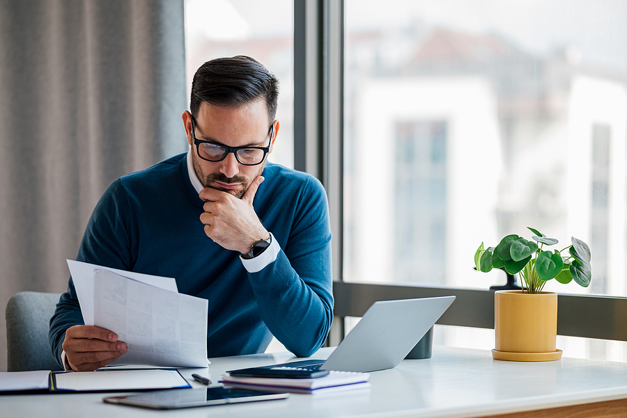 Business owner reviewing business documents