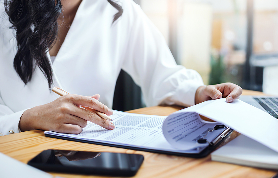 Woman entrepreneur reviewing documents