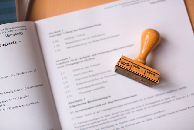 Brown wooden hand tool on white printer paper 